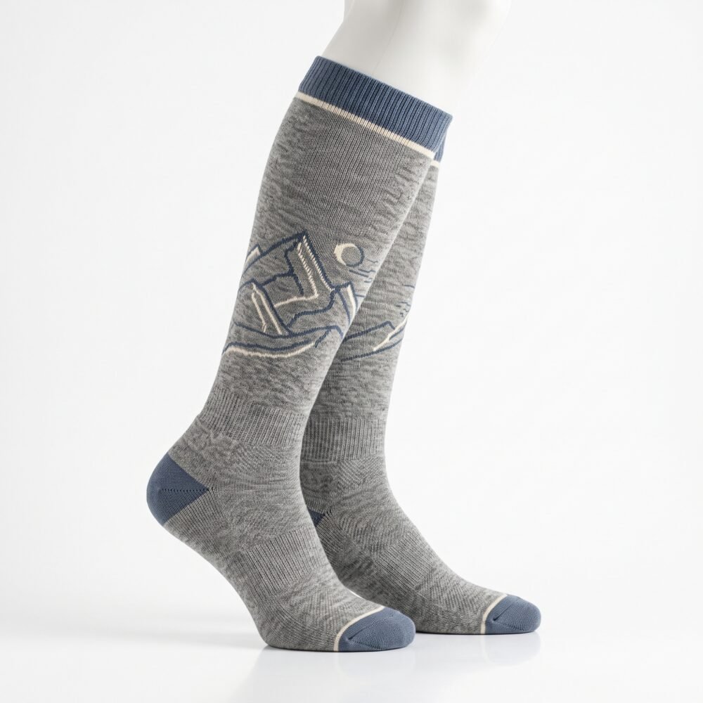 Merino wool compression socks in gray with navy accents and mountain pattern