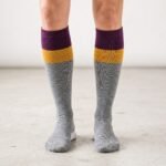 Merino wool compression socks with gray plum and mustard color block stripes