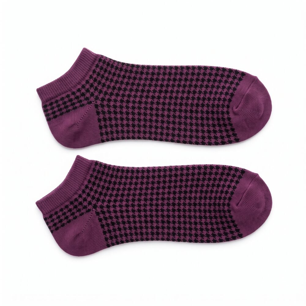 Purple and black patterned ankle socks with ribbed cuffs displayed on a white background