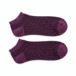 Purple and black patterned ankle socks with ribbed cuffs displayed on a white background