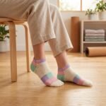 Pair of pastel color block ankle socks in cream, pink, mint green and lavender