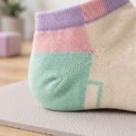 Pair of pastel color block ankle socks in cream, pink, mint green and lavender