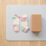 Pair of pastel color block ankle socks in cream, pink, mint green and lavender