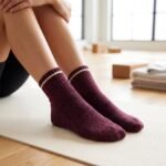 Burgundy ankle socks with white stripe and ribbed knit design