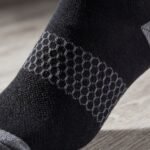 Black and gray ankle socks with textured knit panel, gray heel and toe accents