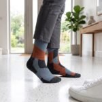 Lehvera merino wool hiking socks with black gray and orange geometric design