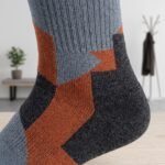 Lehvera merino wool hiking socks with black gray and orange geometric design