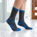 Lehvera merino wool hiking socks in black and blue with cushioned heel and toe zones