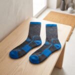 Lehvera merino wool hiking socks in black and blue with cushioned heel and toe zones