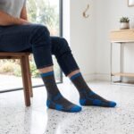 Lehvera merino wool hiking socks in black and blue with cushioned heel and toe zones