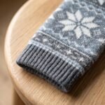 Merino wool compression socks with gray and cream snowflake pattern