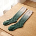 Merino wool compression socks in green gradient knee-high design