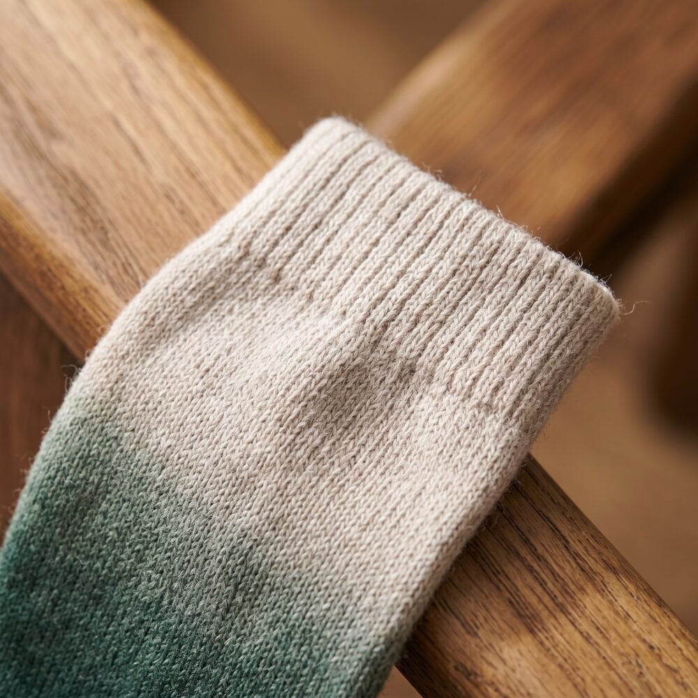 Merino wool compression socks in green gradient knee-high design