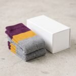 Merino wool compression socks with gray plum and mustard color block stripes