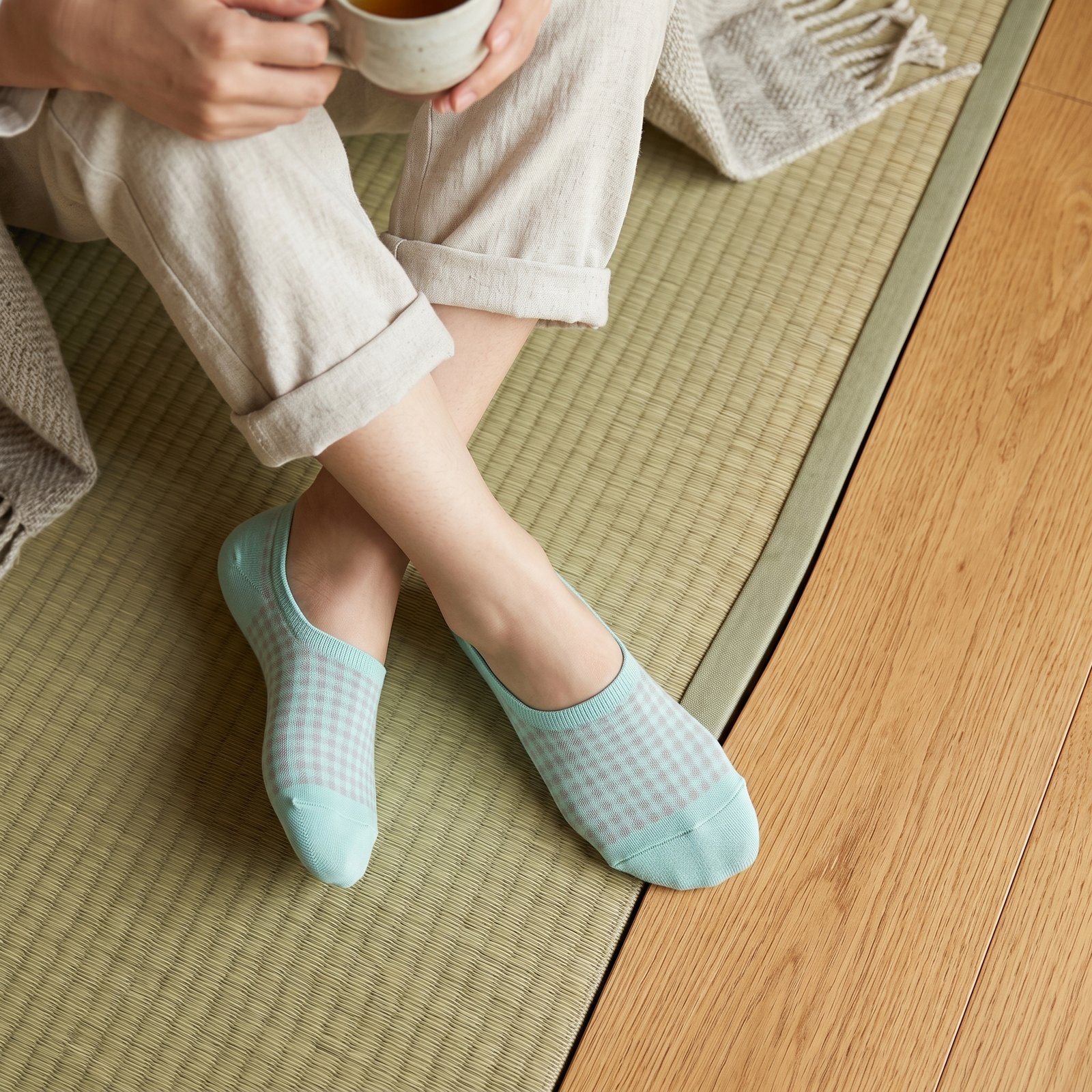 Mint-Green-Gingham-No-Show-Socks A pair of mint green no show socks with a grey gingham pattern laid flat against a white background.