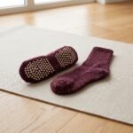 Maroon speckled Pilates socks with non-slip grip dots on the soles