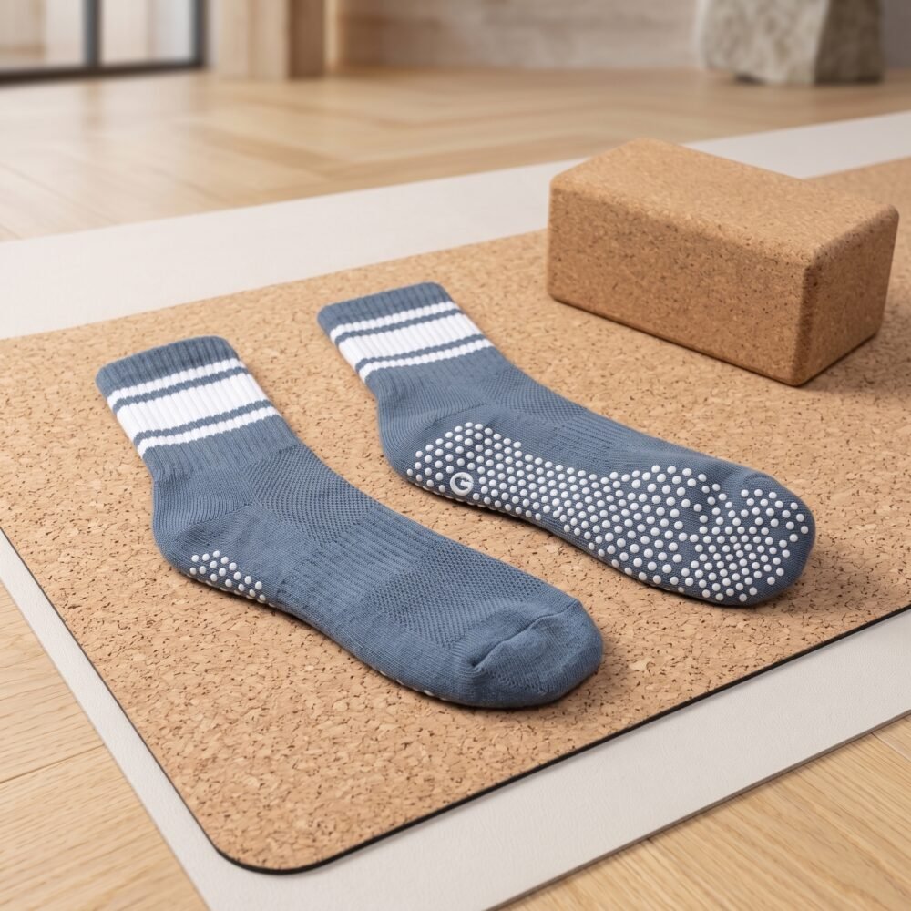 Blue and white striped pilates socks with non-slip grip dots on the soles