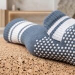 Blue and white striped pilates socks with non-slip grip dots on the soles