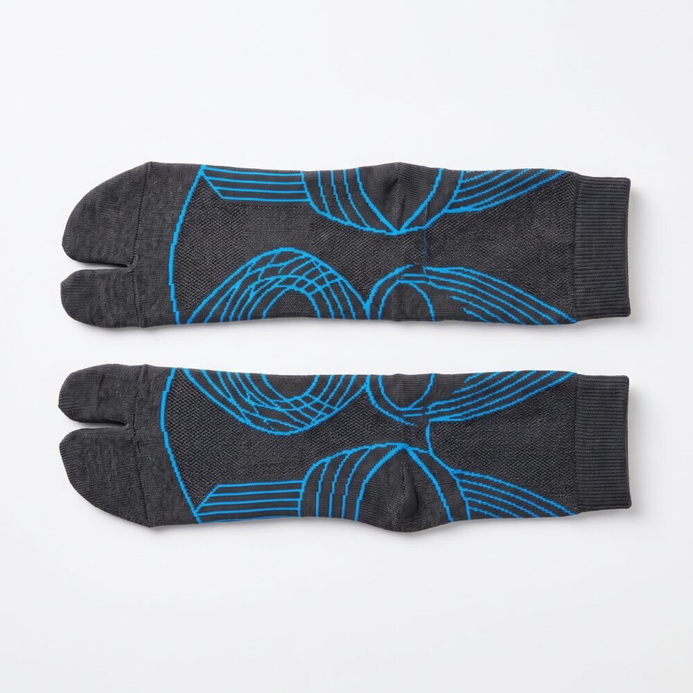 A pair of dark grey crew-length Tabi socks featuring a bright blue abstract wireframe pattern, laid flat against a crisp white background.