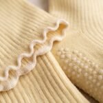 Cream women’s crew grip socks with non-slip grip dots and scalloped cuffs