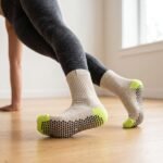 Women wearing beige Women’s Crew Grip Socks with black and lime green non-slip grip soles