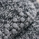 Women’s black and gray crew grip socks with full non-slip sole grip pattern